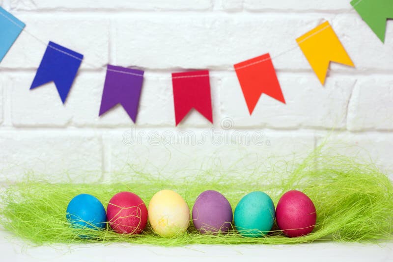 Easter eggs and flags. decoration for Easter holiday with easy DIY Easter flags. Do-it-yourself style selective focus. royalty free stock images