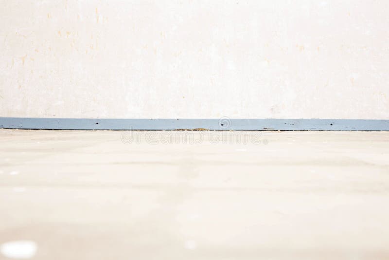 Empty room with wall and wooden floor and plinth needs renovation royalty free stock image