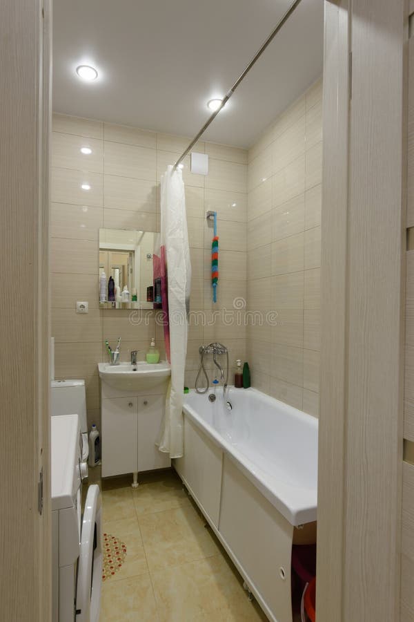 The entrance to the furnished bathroom is combined with the toilet. The entrance to the furnished bathroom is combined with the  toilet stock photo