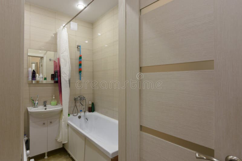 The entrance to a small combined bathroom in the apartment. The entrance to a small combined bathroom in the  apartment royalty free stock photography