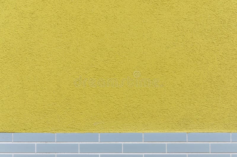 Facade tiled base, partly plastered with design from the 60s as background. In germany royalty free stock images
