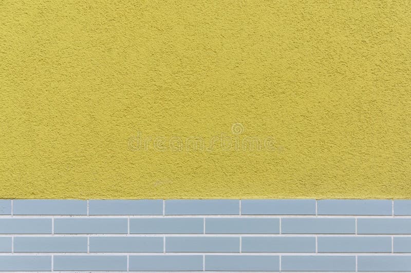 Facade tiled base, partly plastered with design from the 60s as background. In germany stock photography