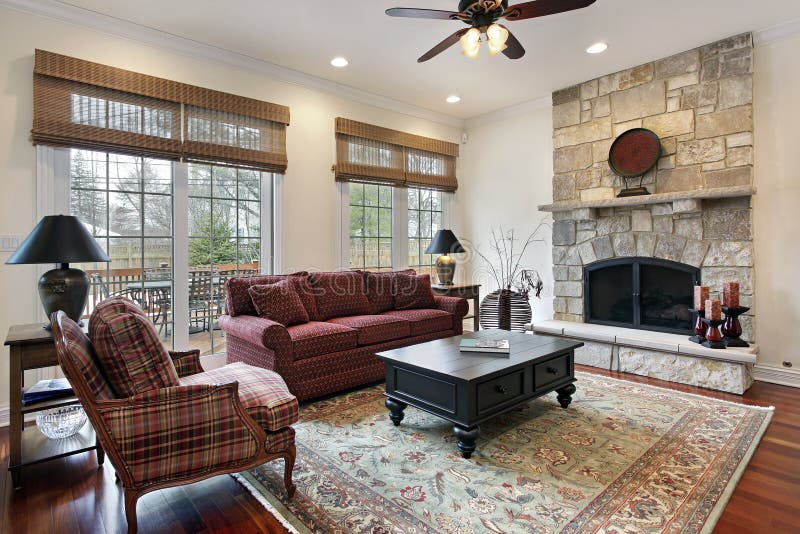 Family room with stone fireplace. Family room in luxury home with stone fireplace stock photos