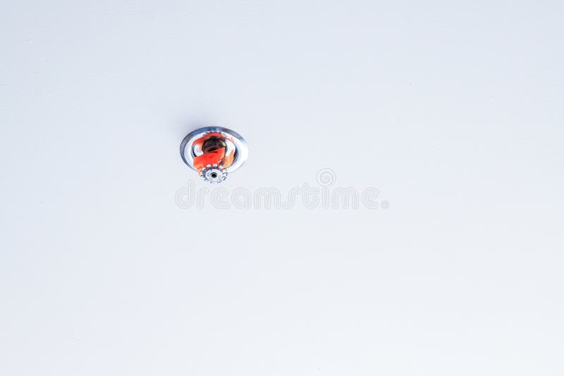 Fire sprinklers on white ceilings background. Room in house, with fire sprinklers on white ceilings background, selected focus on fire sprinklers stock photos