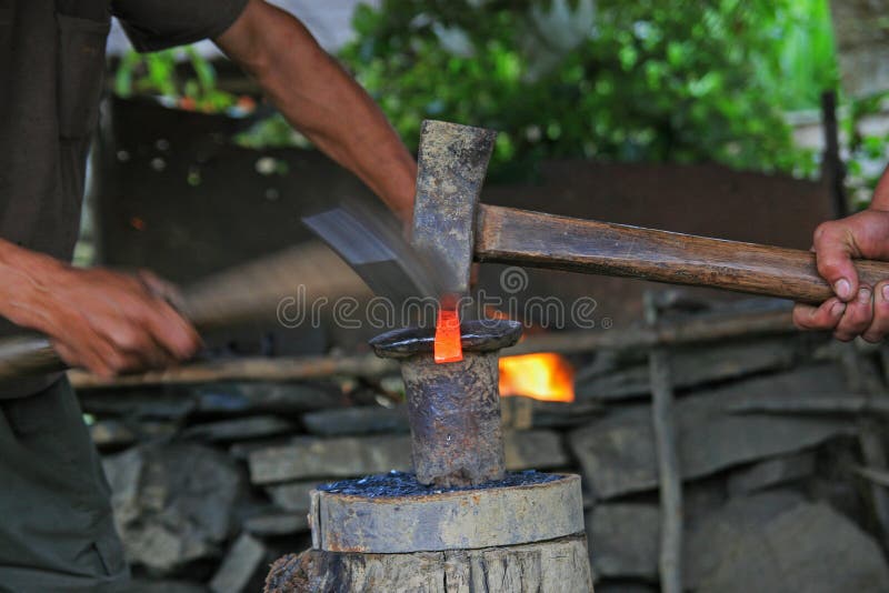 Blacksmiths forging tools. With hammers royalty free stock images