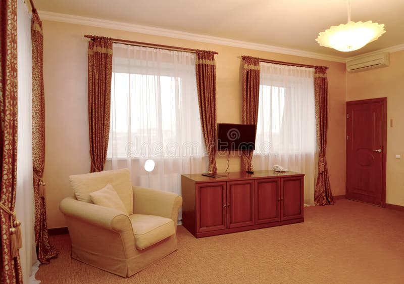 Fragment of an interior of the hotel room in brown tones.  royalty free stock image