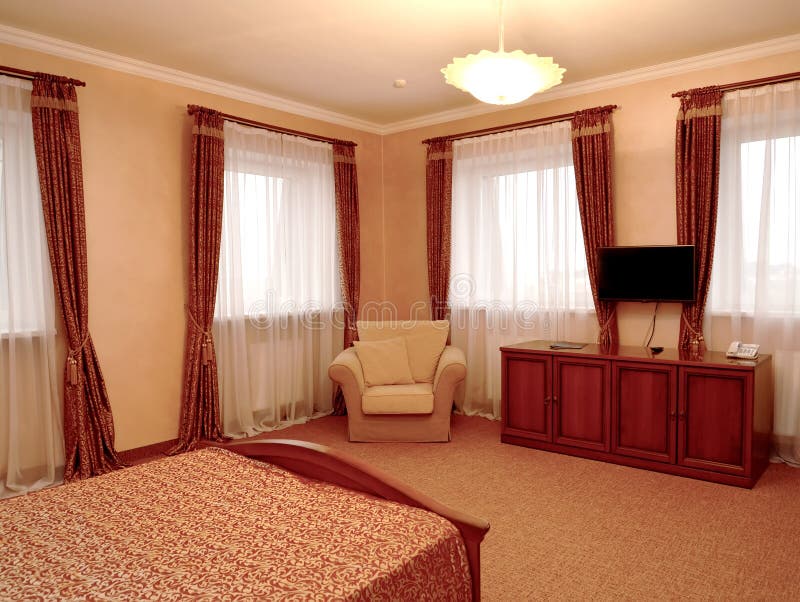 Fragment of an interior of the hotel room in brown tones.  stock photography