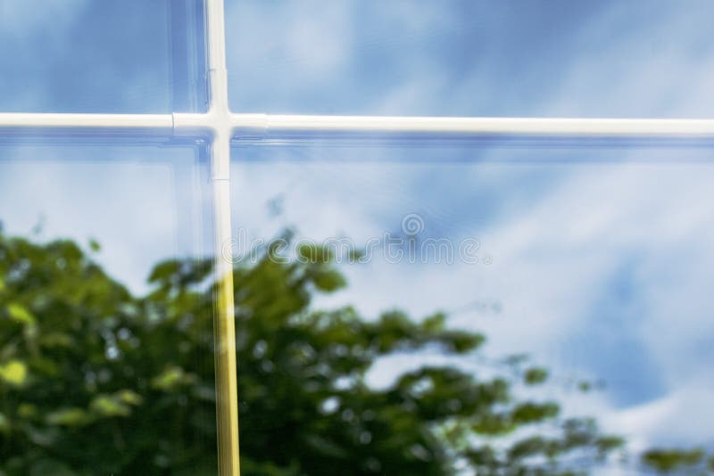 A fragment of a plastic laminated window. With partitions in mirrored double-glazed Windows stock images