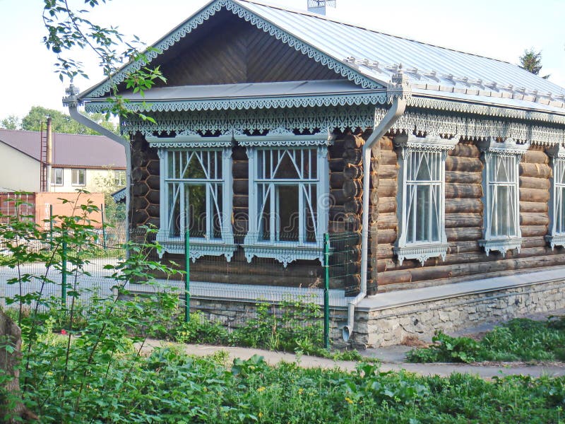 A fragment of the wooden facade hut. The window architraves. Folk art. Russian village. Old wooden houses. Monument of ancient Russian architecture stock images