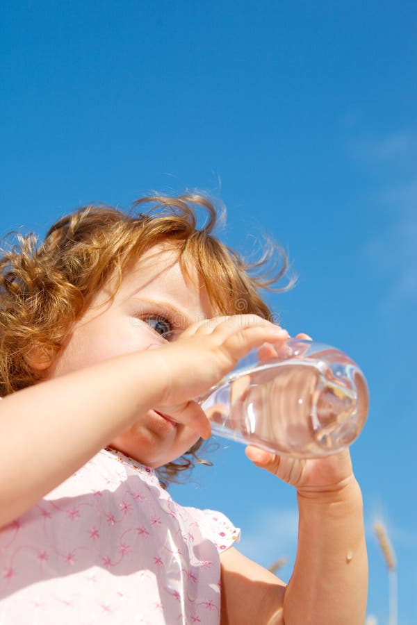 Girl drinking water royalty free stock photography