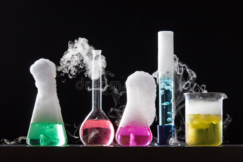 Glass in a chemical laboratory filled with colored liquid during royalty free stock image