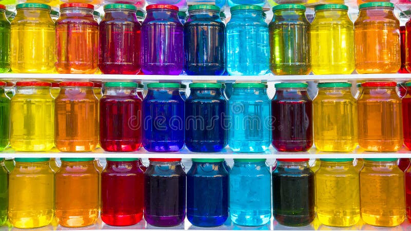 Glass jar with colored liquid stock image