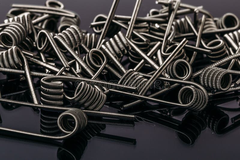 Group of Fussed Clapton Coils for vape or e-cig dripping atomizers or RDA, accessories for vaping. Macro photo stock photos