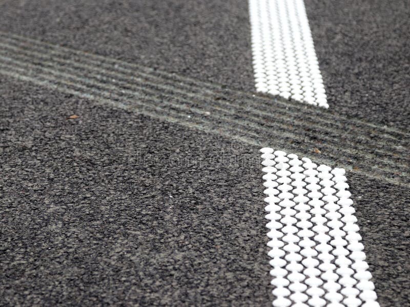 Grouting and hot plastic stripe on asphalt_2. White hot platic stripe on asphalt road royalty free stock photography