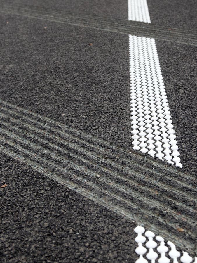 Grouting and hot plastic stripe on asphalt_3. White hot platic stripe on asphalt road stock photography