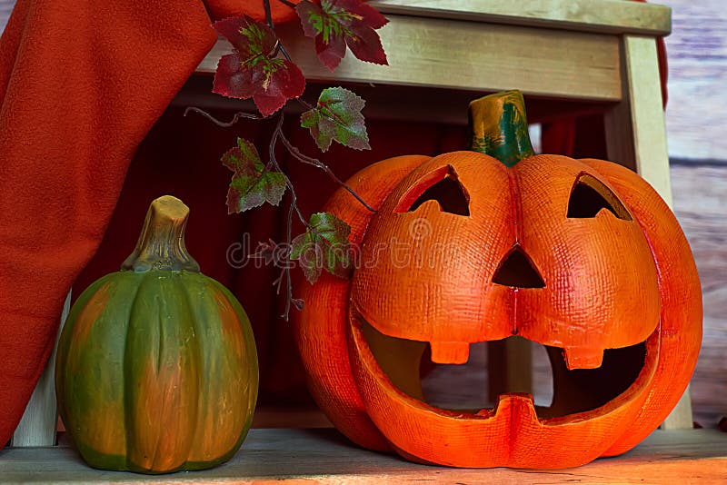 Halloween pumpkins under stairs on the wood background.  royalty free stock image