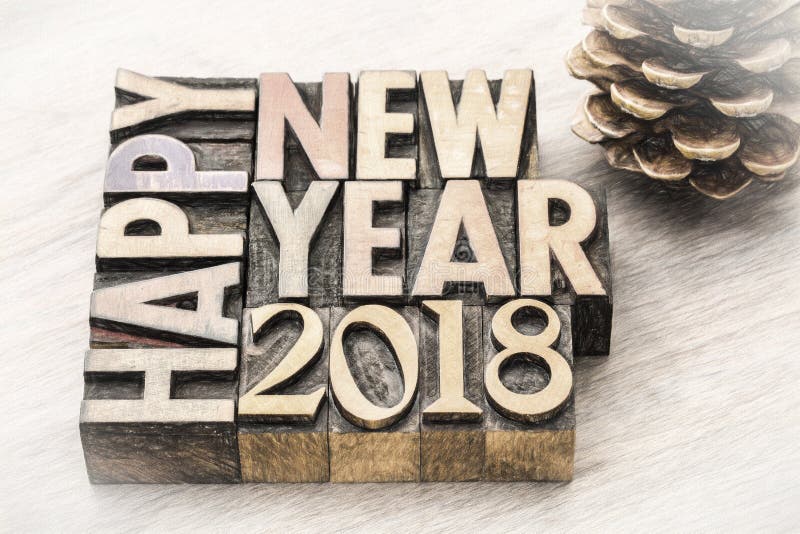 Happy New Year 2018 in wood type. Happy New Year 2018 greeting card - text in vintage letterpress wood type blocks, charco painting digital effect royalty free stock photography