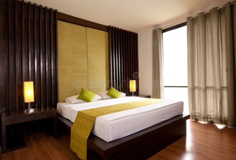Hotel-room. With king size bed in minimalism style royalty free stock photo