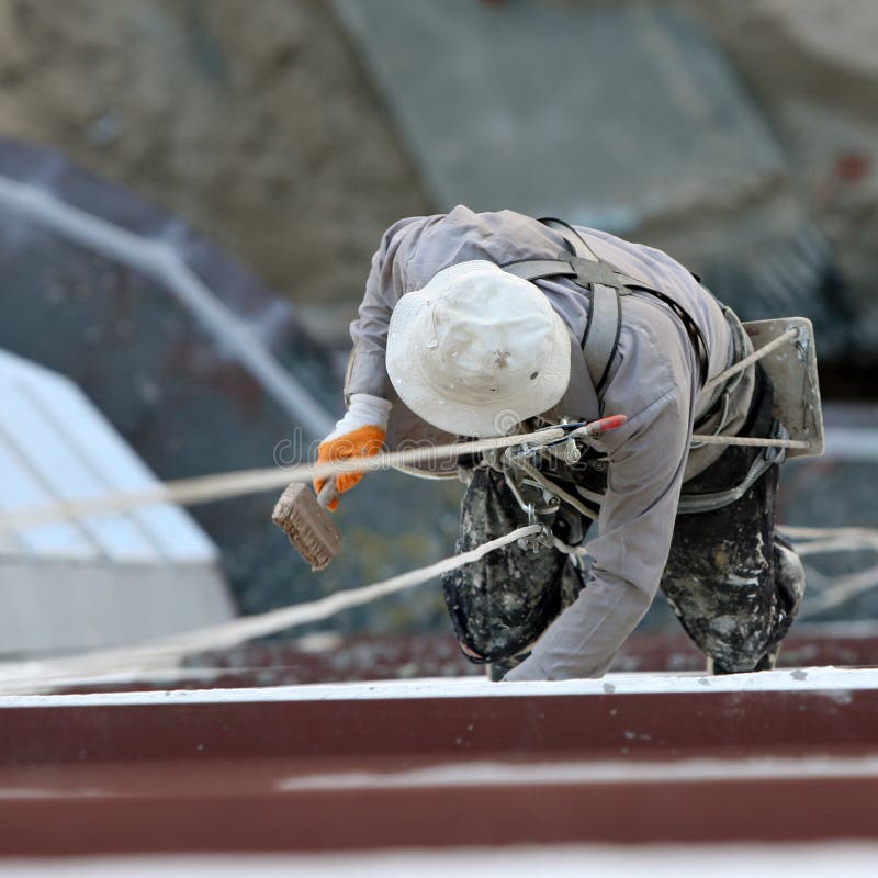 Industrial mountaineering worker (painter) stock photography