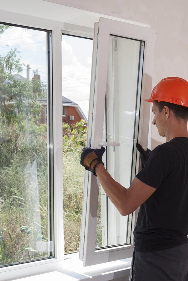 Installation and repair of plastic windows stock images