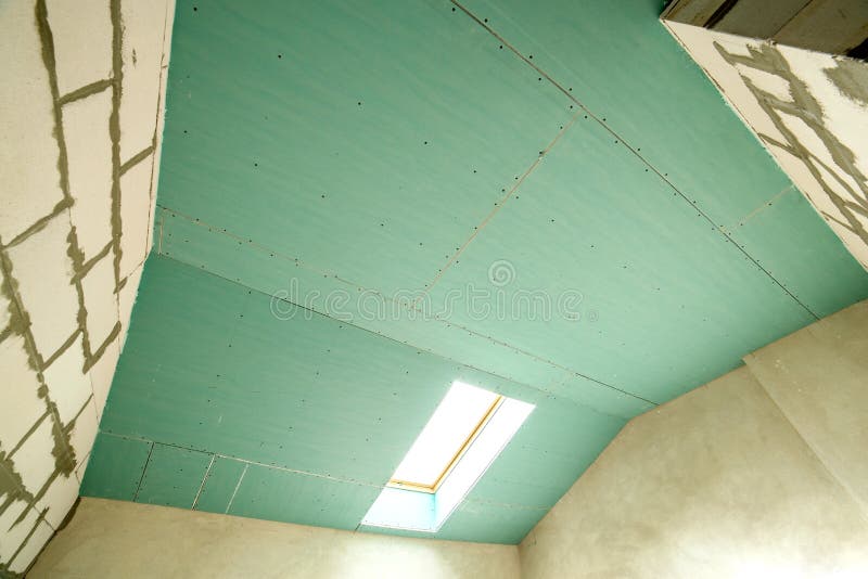 Interior of an apartment room with bare walls and ceiling under construction.  royalty free stock photos