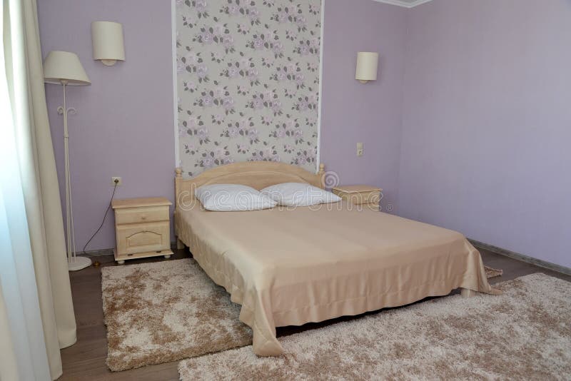 Interior of a bedroom of a double hotel room in light tones. Bedroom royalty free stock photos