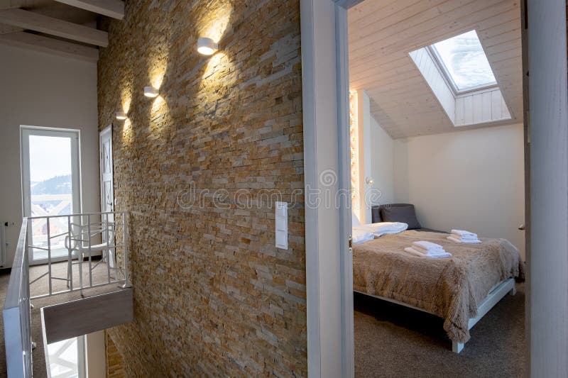 Interior of a contemporary home with spacious hallway, bedroom doors and staircase railing in modern style stock photography