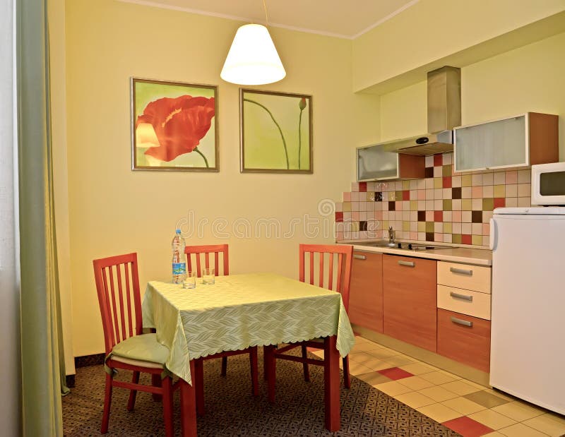 An interior of kitchen in green tones. Hotel room.  stock image