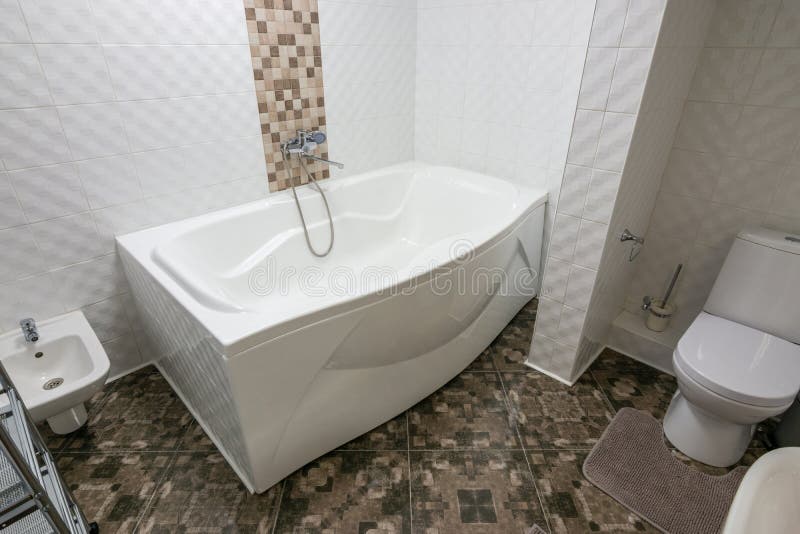 Interior of a large bathroom combined with a toilet. Interior of a large bathroom combined with a  toilet stock photo