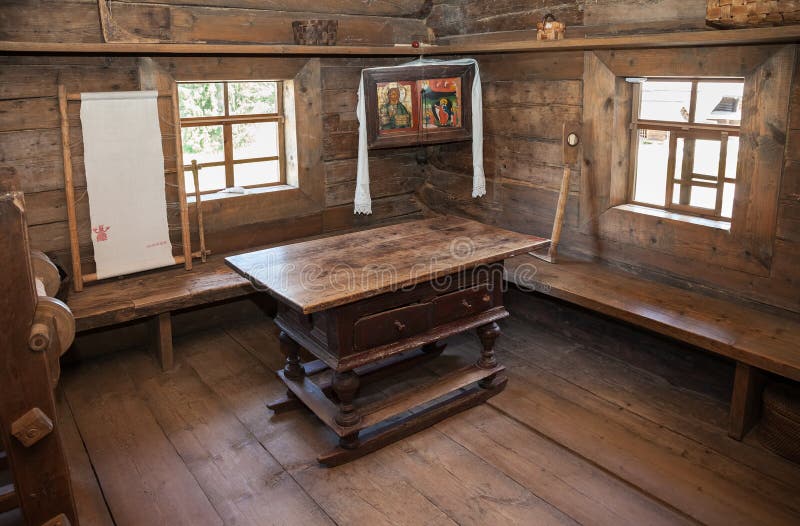 Interior of old rural wooden house. NOVGOROD, RUSSIA - JULY 23, 2014: Interior of old rural wooden house in the museum of wooden architecture Vitoslavlitsy stock photos