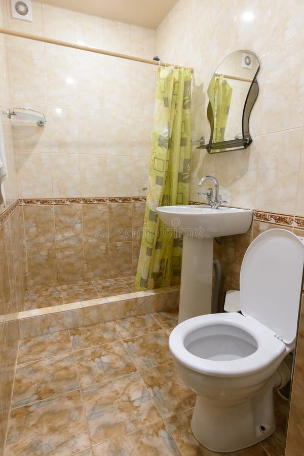 Interior of a small bathroom combined with a bathroom in a guest house. Interior of a small bathroom combined with a bathroom in a guest  house royalty free stock photo