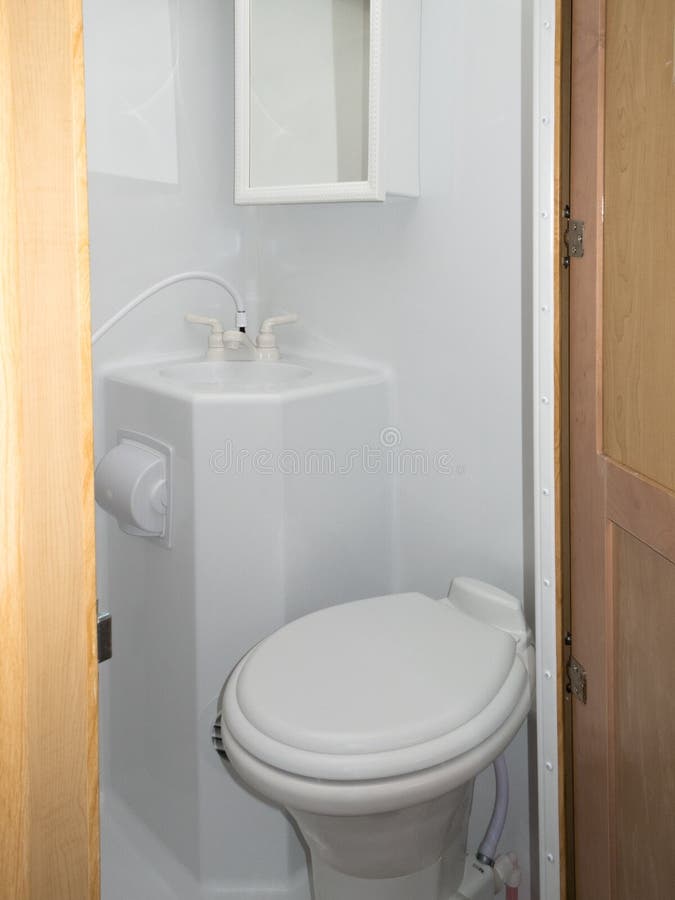 RV washroom toilet sink shower cabinet. Interior of toilet sink shower cabinet wet cell rv recreation vehicle or tiny house washroom royalty free stock images