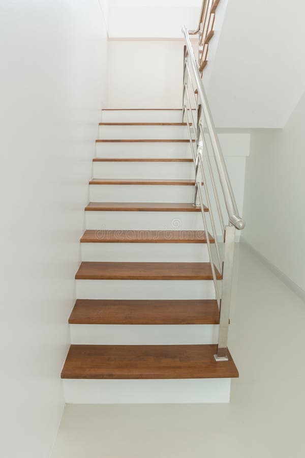 Interior - wood stairs and handrail. In house stock photos