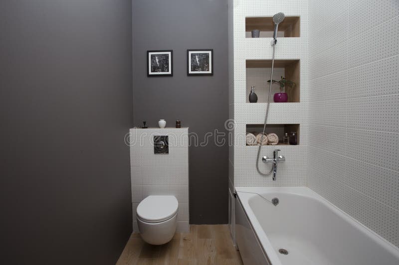 KIEV, UKRAINE - August 22, 2016: interior of a bathroom with a small area with a white tile and gray painted walls. Example of joint Bathroom 4 square meters royalty free stock photography