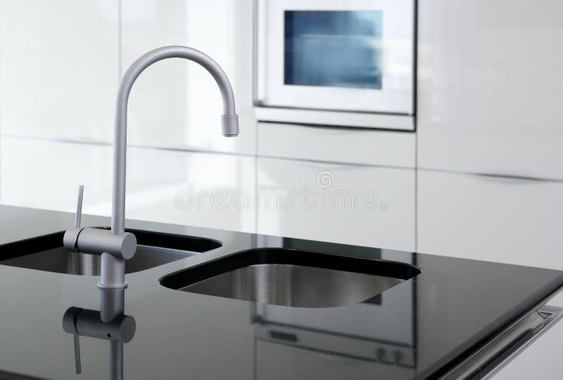 Kitchen faucet and oven modern black and white. Interior design stock photo
