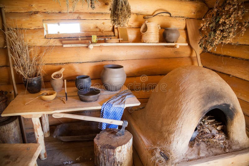 Kitchen in the old peasant log cabin royalty free stock images