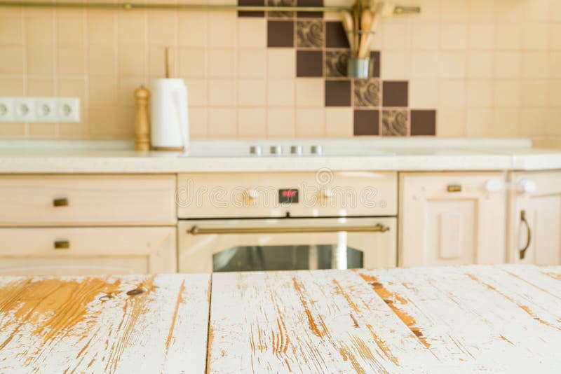 Kitchen table with blur kitchen counter. In background royalty free stock photos