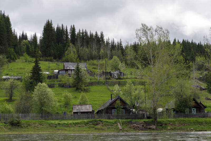 Typical Ural village on the river royalty free stock photography