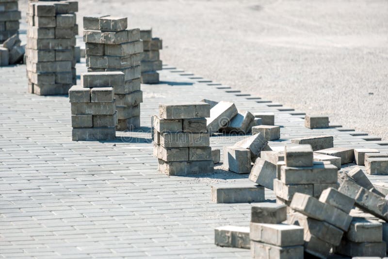 Laying new tiles preparation of works laid out tiles. On the border with sand royalty free stock photography