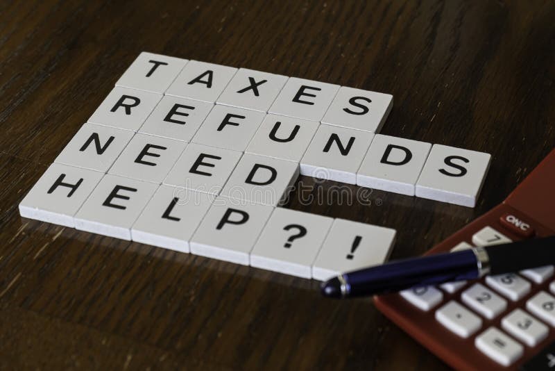 Letter tiles used to advertise tax preparation services. Financial Concepts stock photos