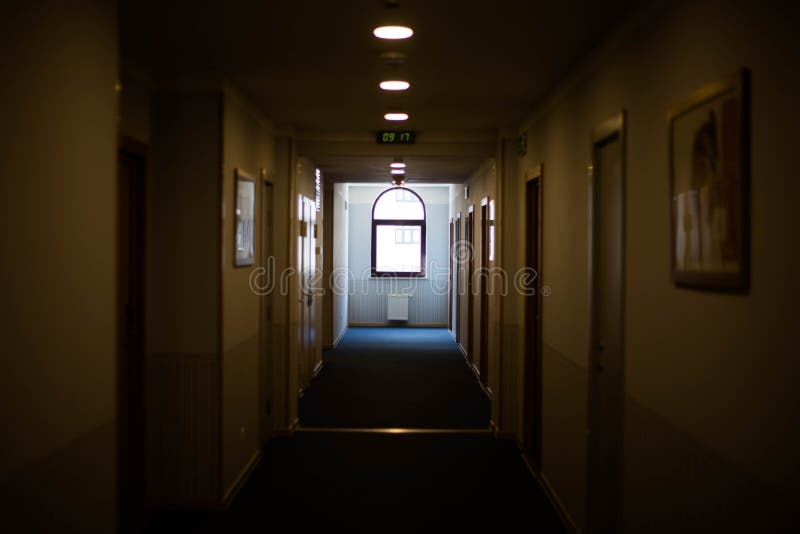 A long dark corridor in the hotel. stock images