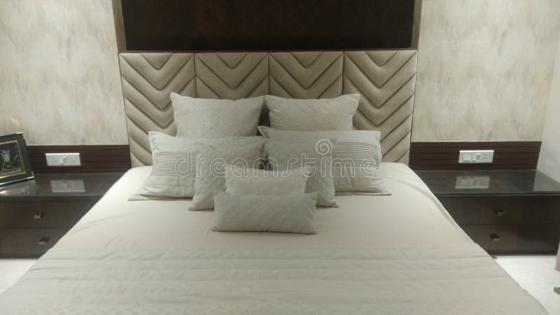 Luxury bedroom with pillows arranged stock photos