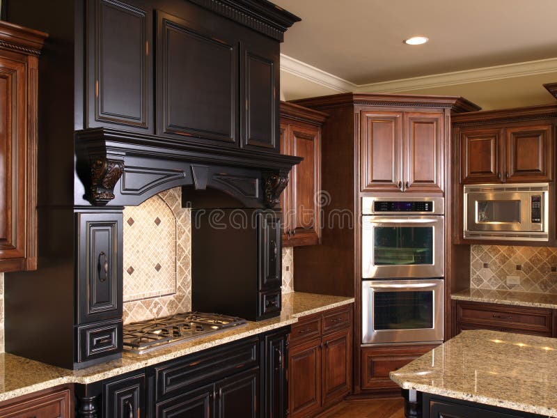 Luxury center island Kitchen burners & oven. Luxury center island Kitchen burners and oven stock image