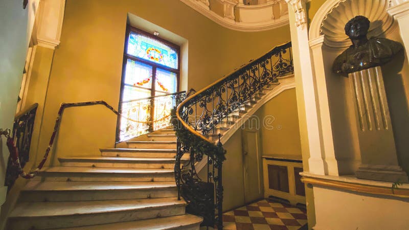 LVIV, UKRAINE - DECEMBER 7, 2019: Potocki Palace in Lviv. Stairs leading up to the next floor of a building. LVIV, UKRAINE - DECEMBER 7, 2019: Potocki Palace in royalty free stock photo
