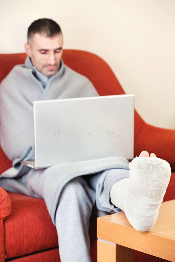 Man with broken leg royalty free stock image