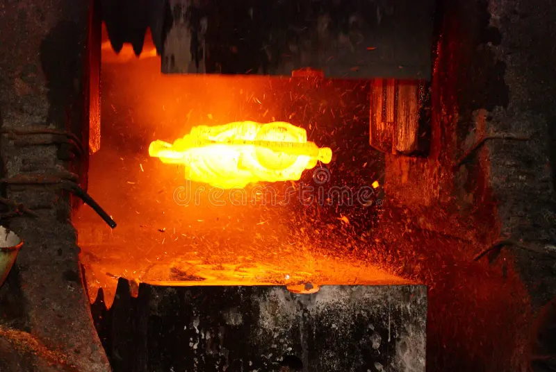 Metal forging. hydraulic hammer shapes the red hot billet. the production of high tech parts.  royalty free stock photo