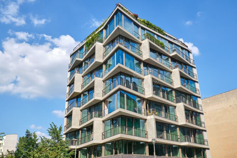 Modern apartment building with floor-to-ceiling windows. Seen in Berlin, Germany stock photography