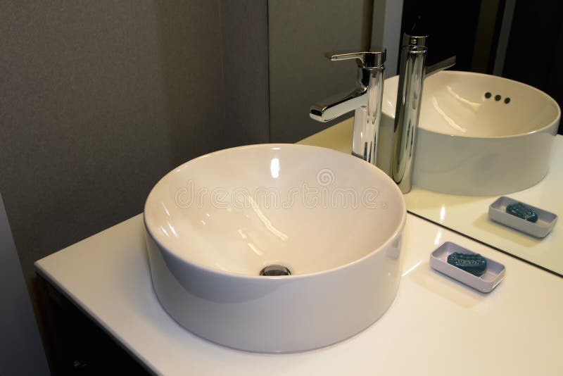 Modern Bathroom Bowl Sink, Faucet, and Counter stock images