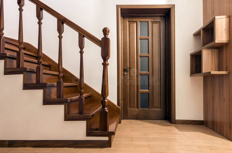 Modern brown oak wooden stairs and doors in new renovated house. Interior stock photos