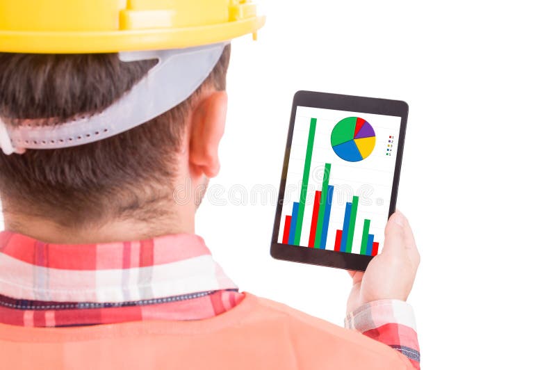 Modern builder or construction worker checking charts on tablet stock photos